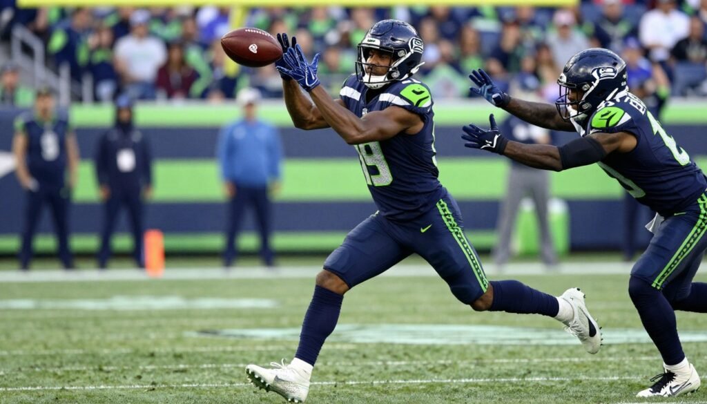 Seahawks wide receiver Jaxon Smith-Njigba making a catch against tight coverage